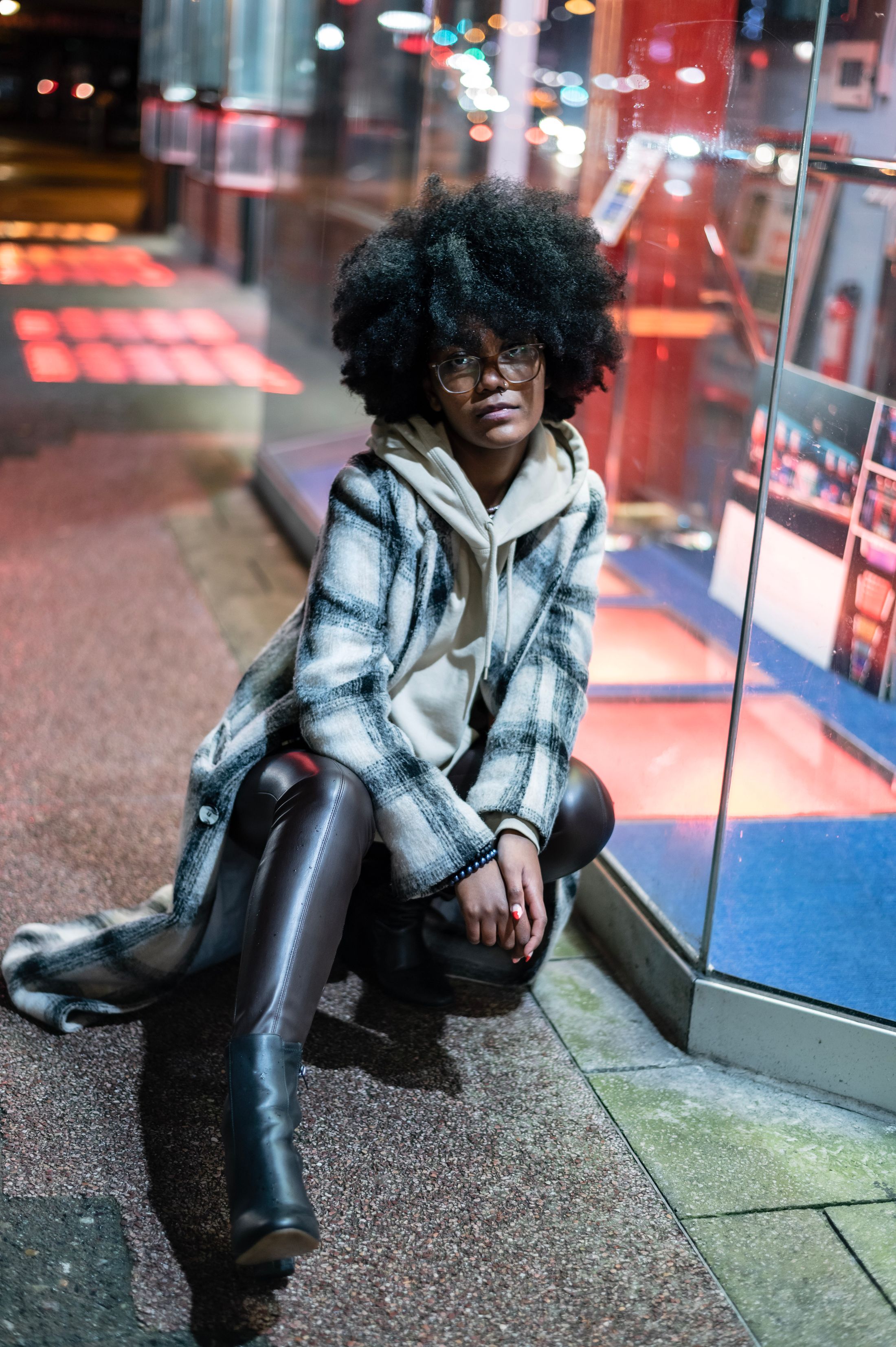 Black woman in the city at night